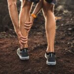 male runner holding injured calf muscle and suffer JWUGYE3
